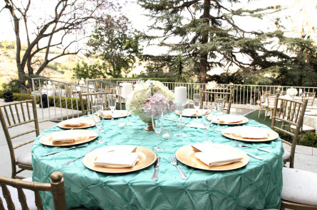 Outside dining area with teal table settingss
