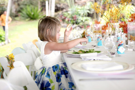 Outside dinging area with small girl eating food